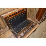 A Victorian walnut and brass bound writing box