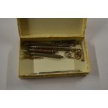 A box of 19th Century silver and other propelling