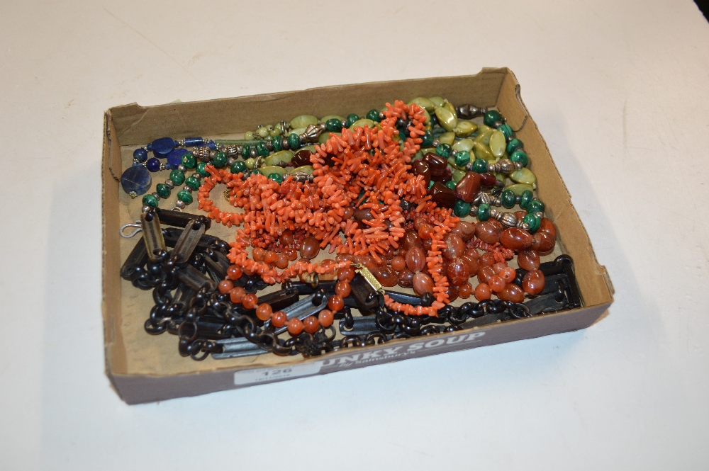 A tray of various necklaces to include coral, mala