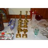 Five various pairs of brass candlesticks