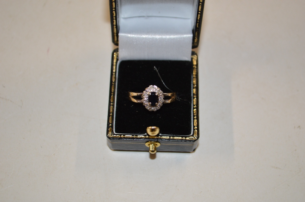 A 9ct gold diamond and sapphire set ring