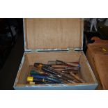 A wooden box of wood turning chisels