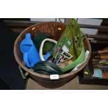 A wooden barrel and a box of various tools; a tug