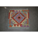 An approx. 1'8" x 1'7" Chobi rug