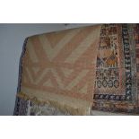 An approx. 3'6" x 2' Eastern patterned rug togethe