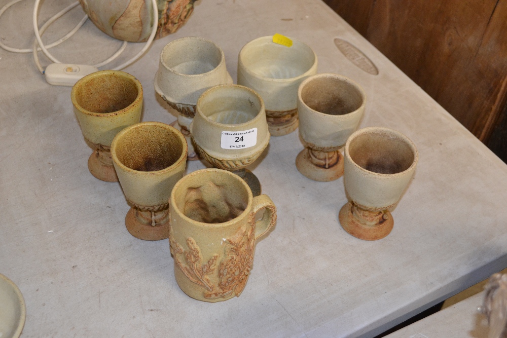 A Bernard Rooke pottery mug, and seven goblets