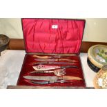 A horn handled seven piece carving and serving set