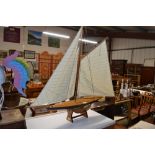 A wooden model sailing yacht