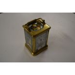 A brass cased carriage clock with key