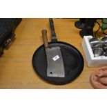 A German meat cleaver; and a skillet