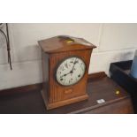 An Edwardian oak and inlaid two hole mantel clock