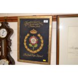 A gilt framed embroidery relating to the Hampton C