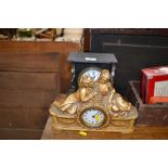 A late Victorian black slate mantel clock AF; and