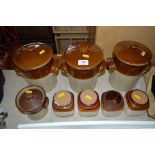 A quantity of glazed storage jars