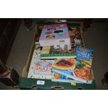 A box of various cookery books