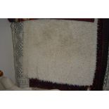 An approx. 5'6" x 4' wool rug