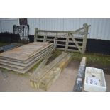 A pair of wooden gates and posts with fixings