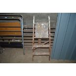 A small wooden step ladder