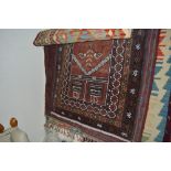 An approx. 4'4" x 2'10" old Balochi rug