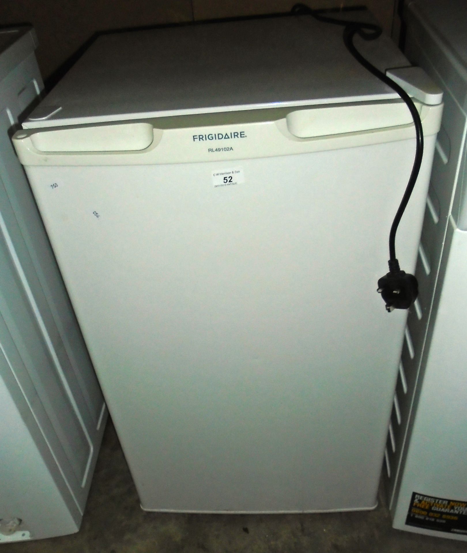 A Frigidaire white under counter fridge