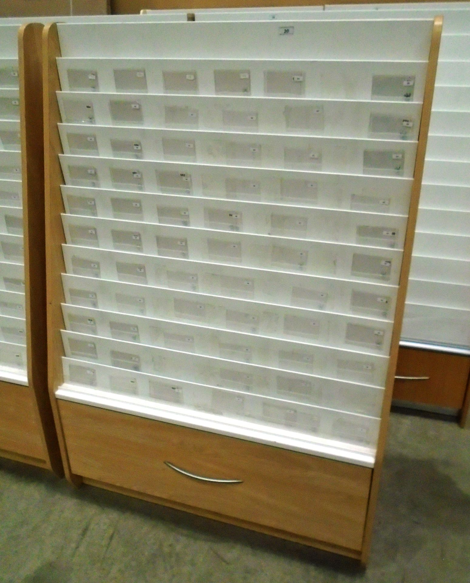 A pine finish double sided 24 section card display rack with storage drawer 100 x 150cm