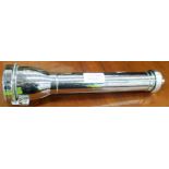 A large chrome cased torch