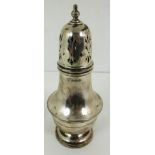 A silver sugar caster shaker with baluster body, pierced removable decorative lid with finial,