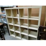 A maple finish 16 shelf pigeon hole style display cabinet 150 x 150cm high