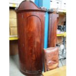 An unusual pair of Victorian curved mahogany corner wardrobes with damages each approx 80cm x 214cm