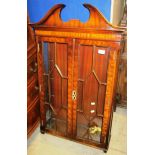 A mahogany wall mounted cabinet with twin tracery glazed doors 60 x 97cm high