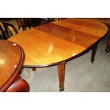 A mahogany 'D' ended extending dining table (1 extra leaf) on tapered legs 107 x 183cm extended
