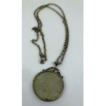 One Dollar coin in a silver mount on a silver chain