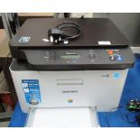 A Samsung Xpress C460W wireless printer complete with power lead