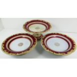 A set of three red and gilt comports/tazzas
