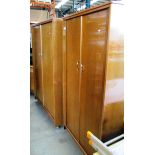 An oak finish 1960's 3 piece bedroom suite comprising 2 x 2 door wardrobes 1 x 120 x 180cm high and