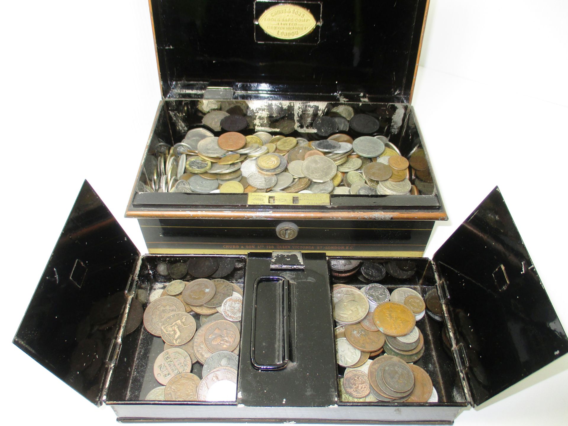 A Chubb & Sons cash box [with key] containing a quantity of assorted world coins