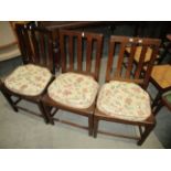 Three oak dining chairs