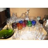 A set of six harlequin wine glasses, a large glass decanter, decorative glassware,