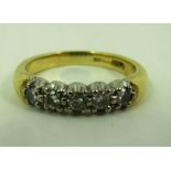 An 18ct gold five stone diamond ring (total approx. weight 3.