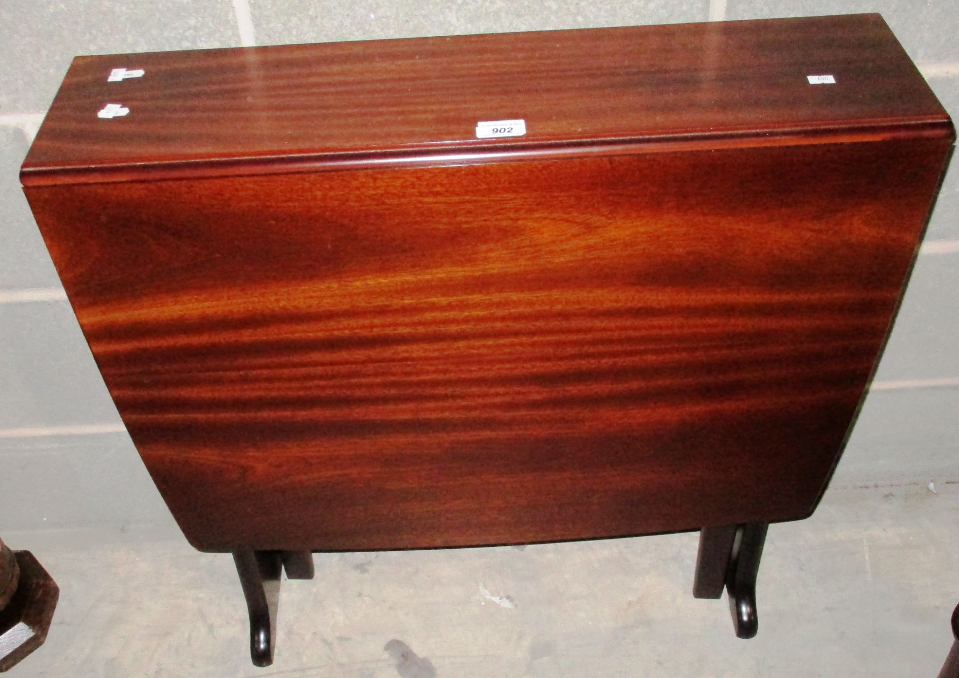 A mahogany drop leaf Sutherland style table