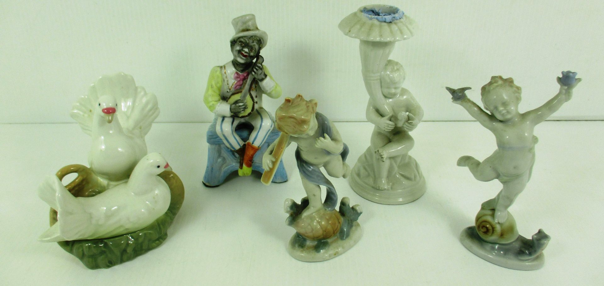 A small quantity of assorted continental figurines