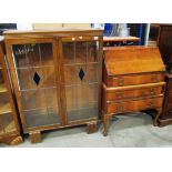 An oak display cabinet with leaded glazed doors 92cm and a walnut bureau with fall flap over 3