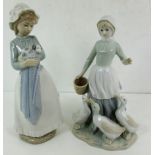 Nao figurine of a girl holding a dalmatian puppy and a St.