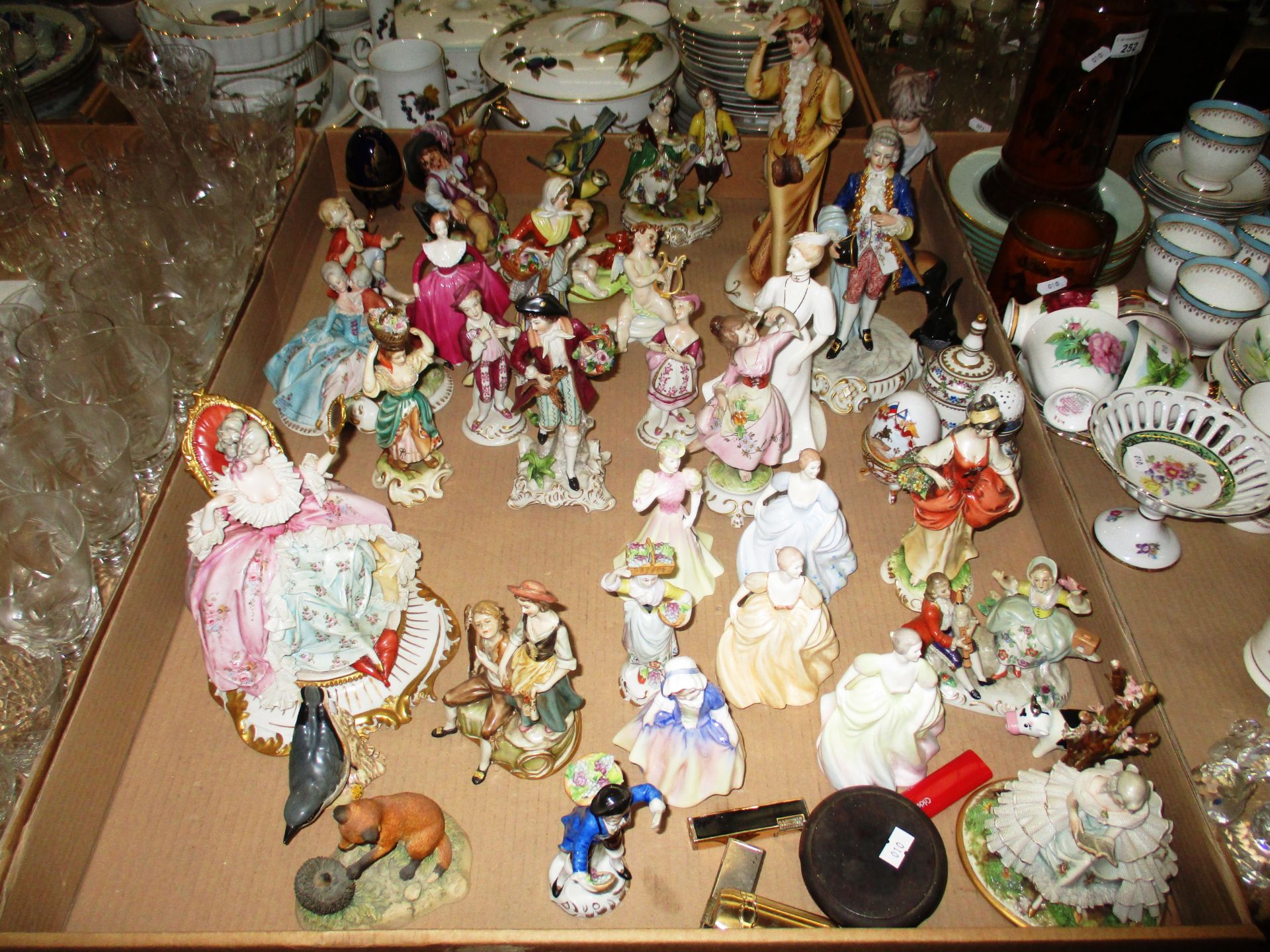 A large quantity of continental figures, Coalport figures, Royal Doulton figure etc.