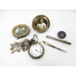 A silver cased pocket watch, a pair of small circular silver mounted photo frames,