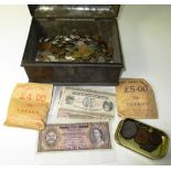 A metal chest containing world coins,