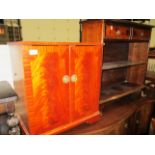 A yew 2 door entertainment/LP storage cabinet and a small mahogany reproduction 2 drawer bookcase