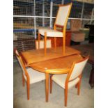 A set of 4 1960's Swedish teak dining chairs by Svegards Markard with beige upholstered seats and