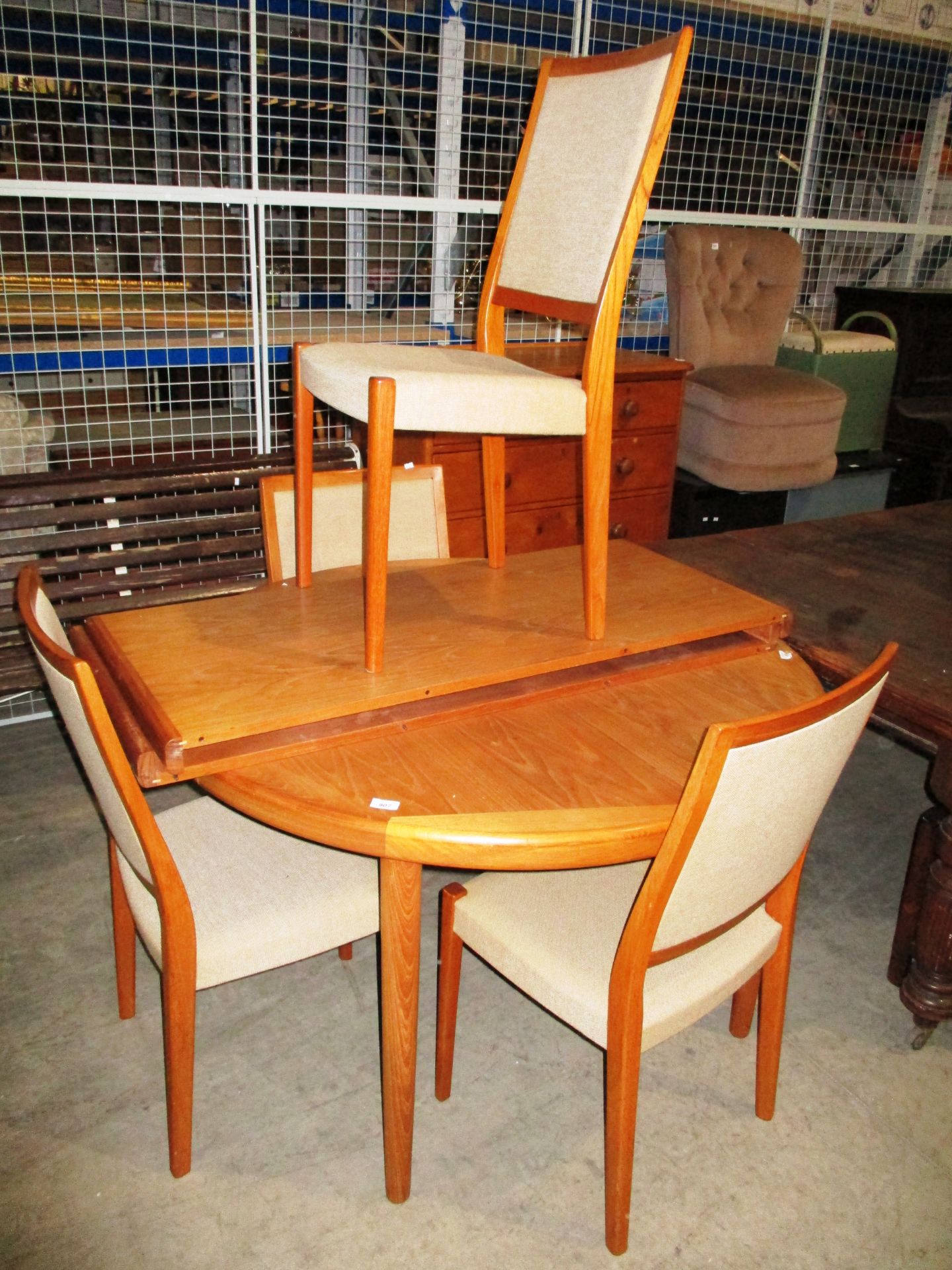 A set of 4 1960's Swedish teak dining chairs by Svegards Markard with beige upholstered seats and