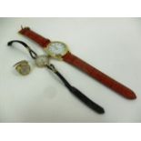 A lady's 9ct gold cased wristwatch on black leather strap,